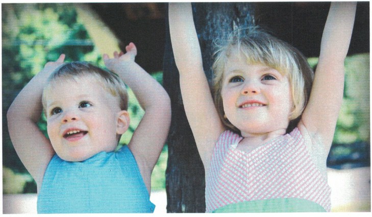 Two children smiling together outdoors