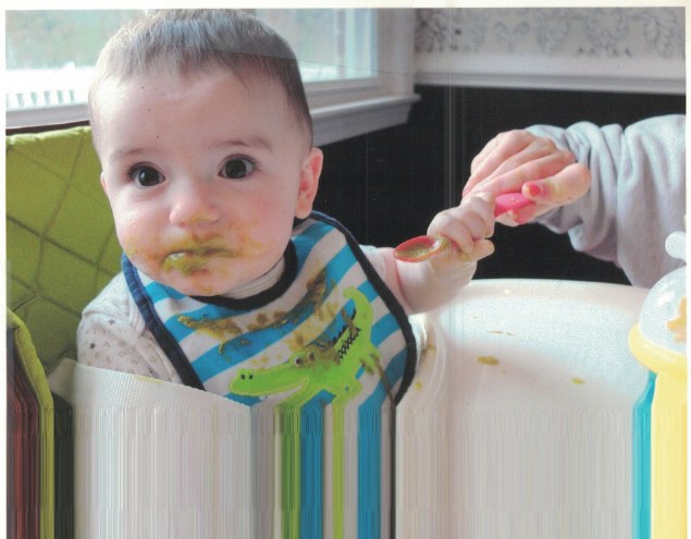 A baby enjoying mealtime
